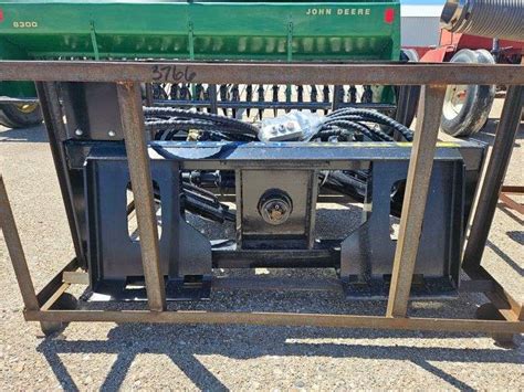 post setter for skid steer|skid steer pole setter.